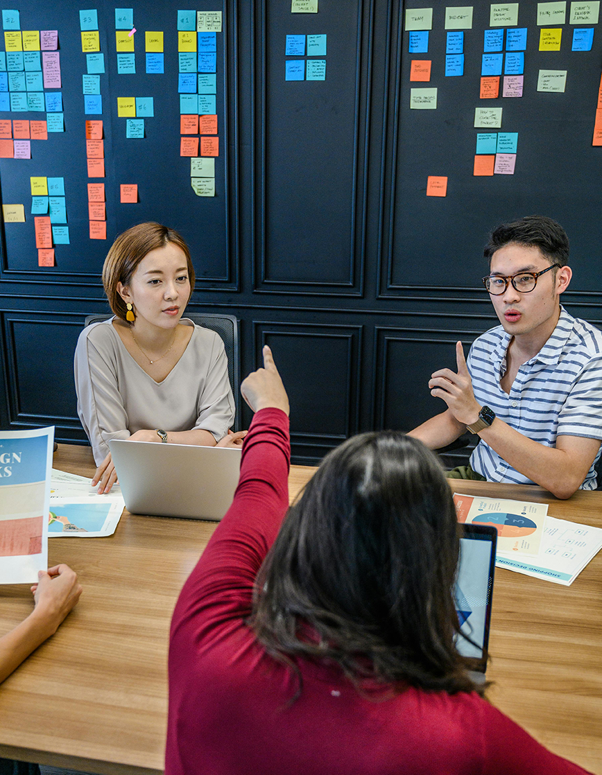 Project Team Collaboration & Planning Discussion Project team collaborating in a modern office during a planning and discussion session.